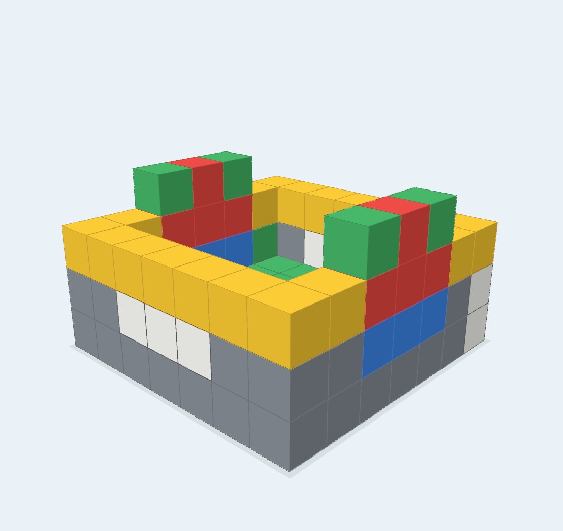 A large fort-like creation with gray walls, a yellow rim, and red, green, blue, and white details